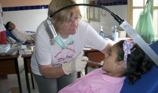Dr Teresa providing dental treatment to a child in Morocco