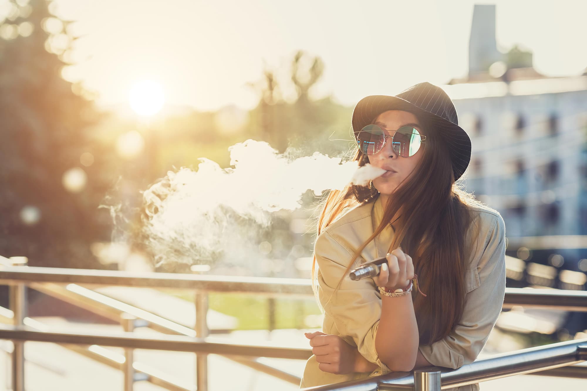 Person vaping to improve oral health