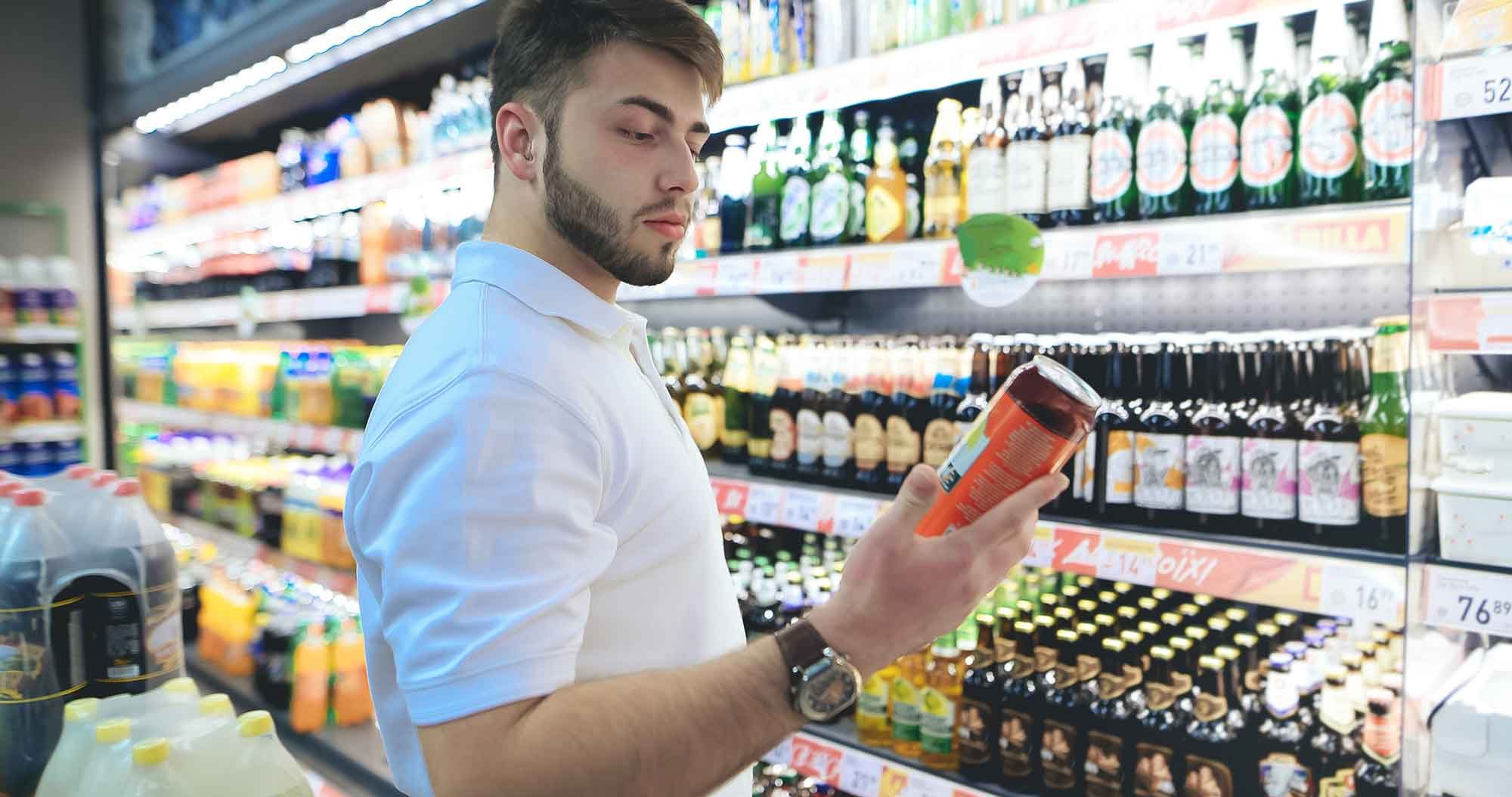 Man looking at alcoholic drinks