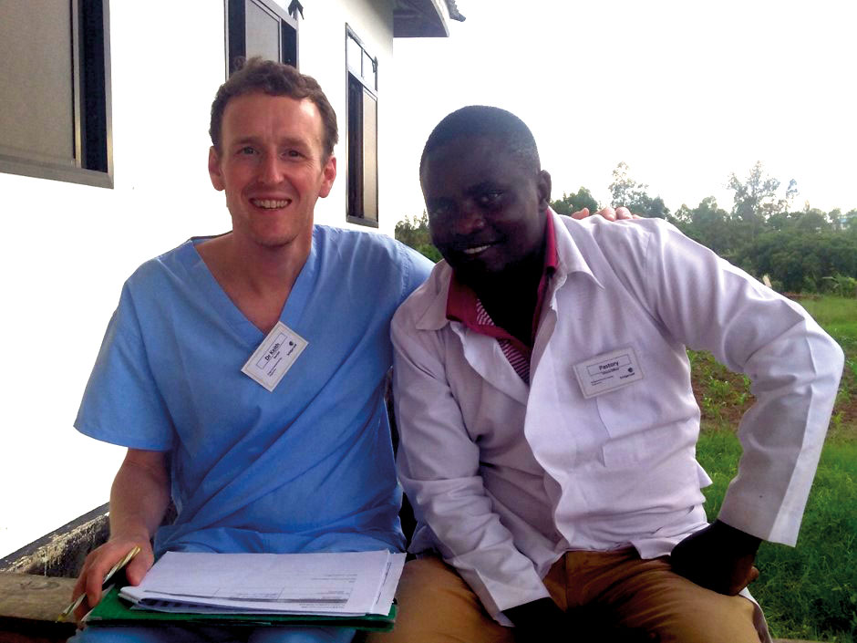 Keith McClean with a health worker during his visit to Tanzania with charity Bridge2aid