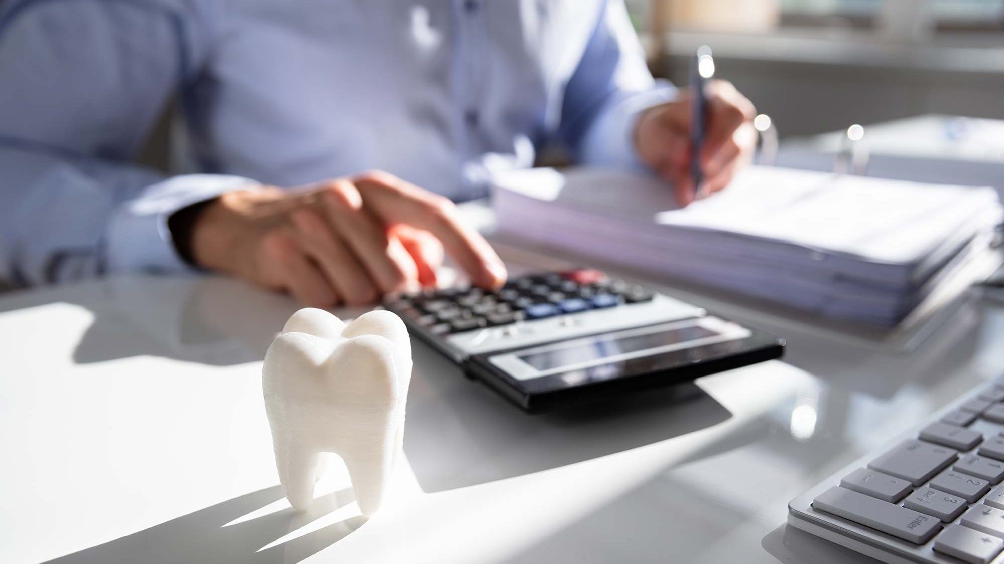 dentist working out finances for restart