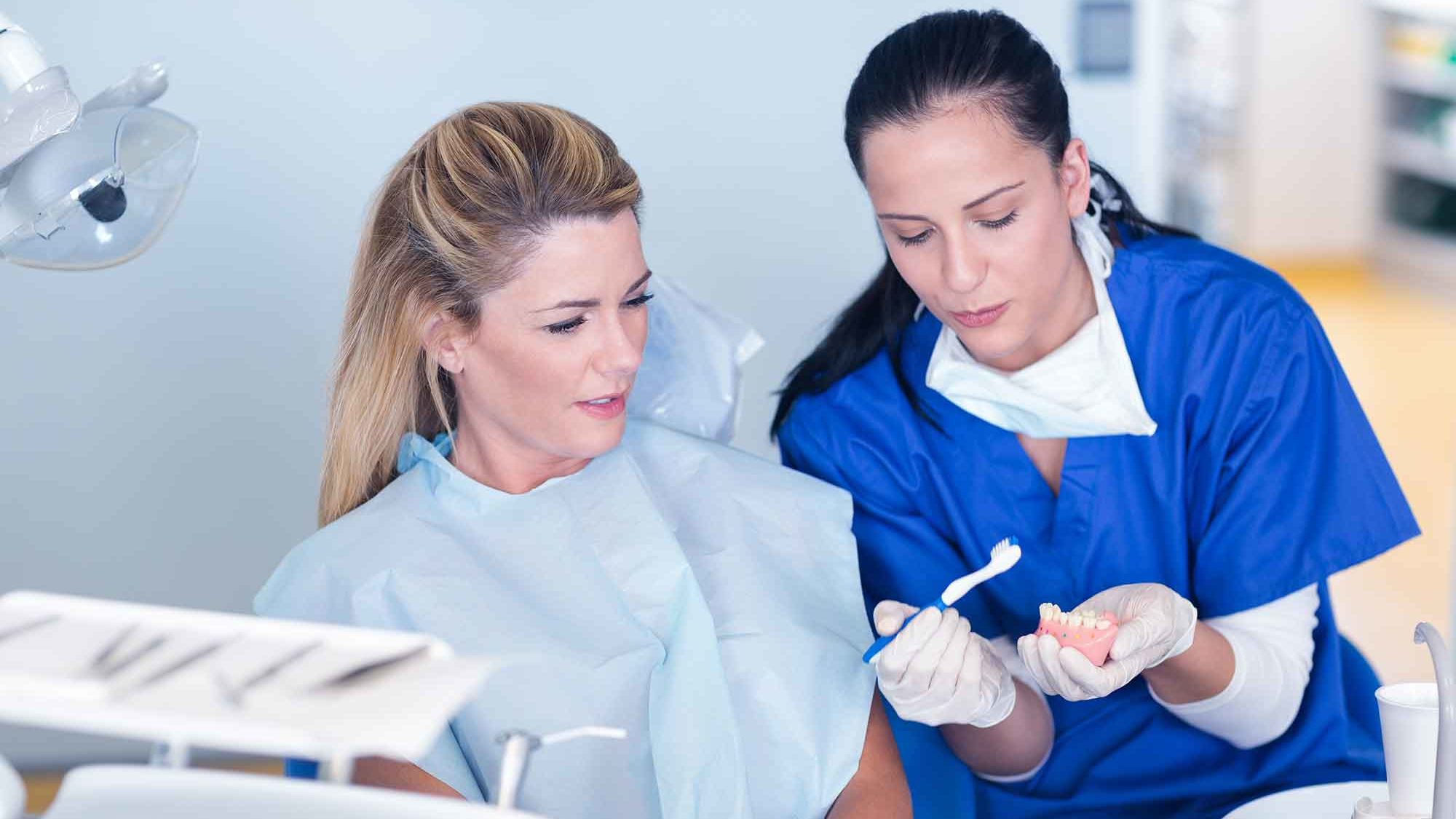 therapist giving oral hygiene education in surgery