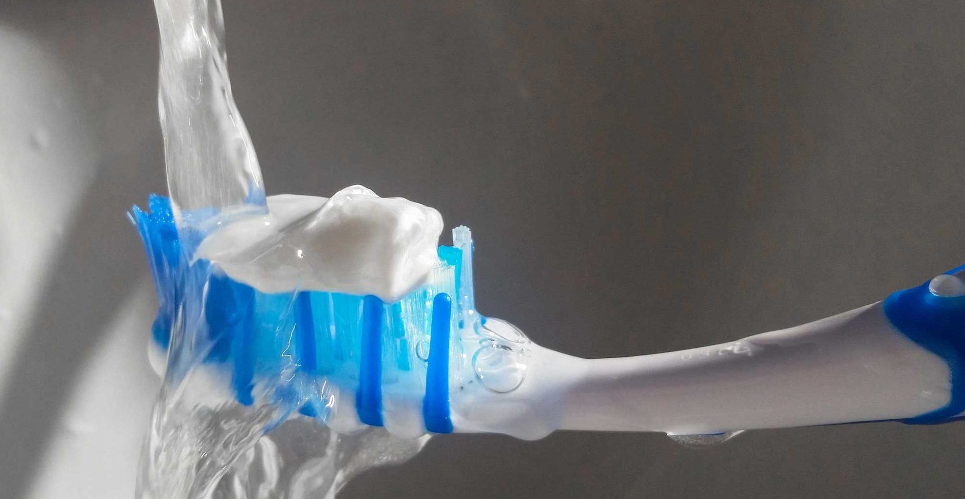 fluoride toothpaste on a brush